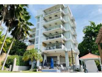 Modern multi-story condo with balconies patio and lush greenery PH Playa Blanca Río Hato Panama