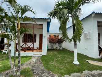 Coastal themed kitchen with blue open shelving, breakfast bar and tile floors in Costa Grande Nueva Gorgona Panama