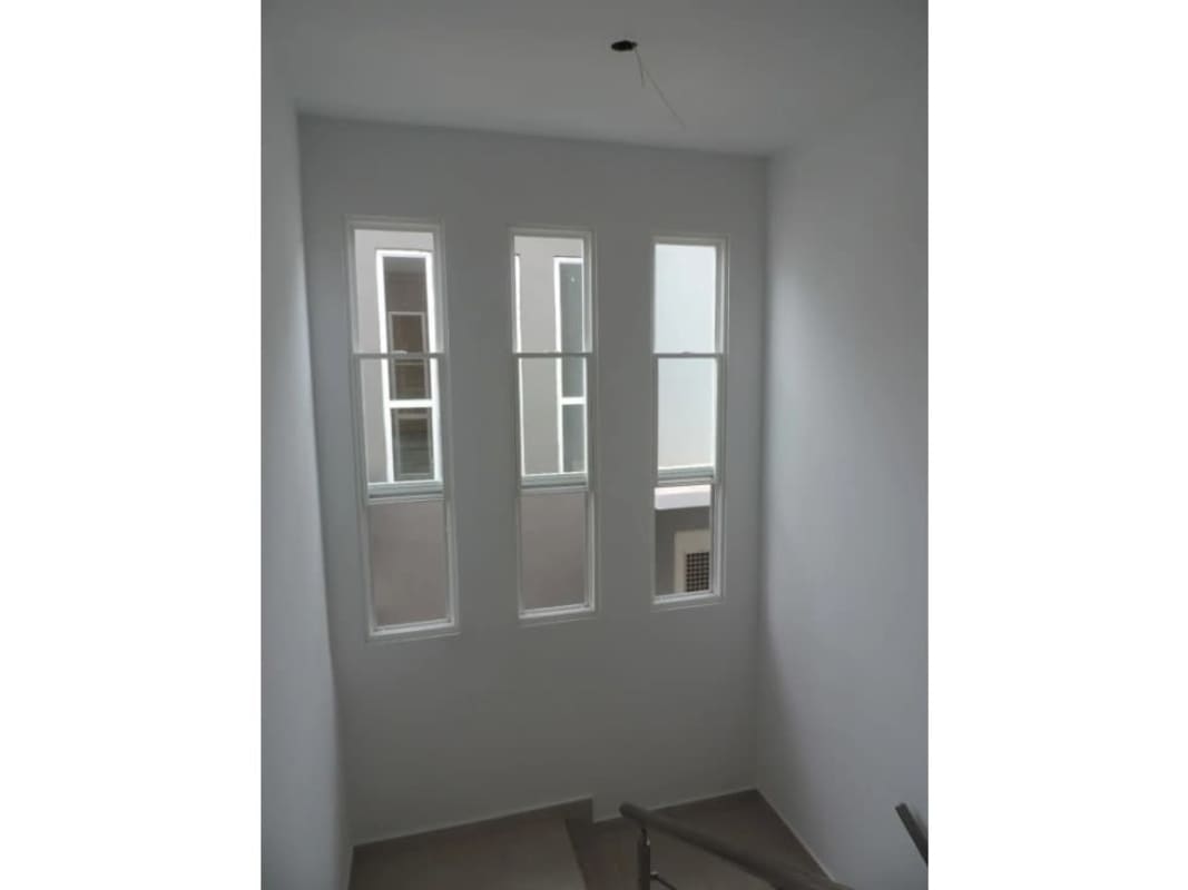 Bedroom with wardrobe and neutral decor PH Victoria townhouse Brisas del Golf