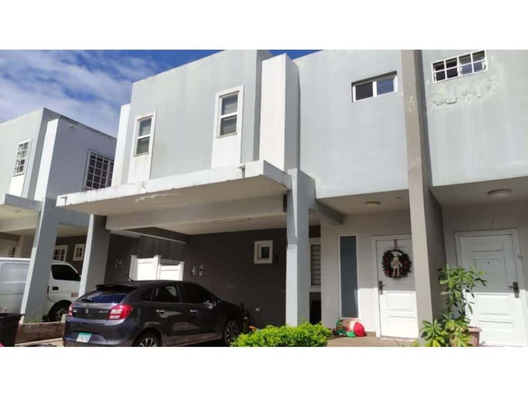 Kitchen interior with upper and lower cabinets and appliances in townhouse Brisas del Golf Panama
