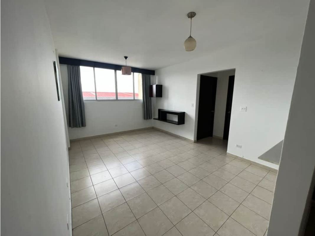 Open kitchen with cabinets and tile backsplash PH Mystic Gates Llano Bonito