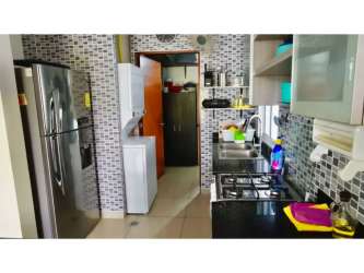 Equipped kitchen with appliances ceramic tile finishes in PH Coral Park Playa Blanca condo Panama