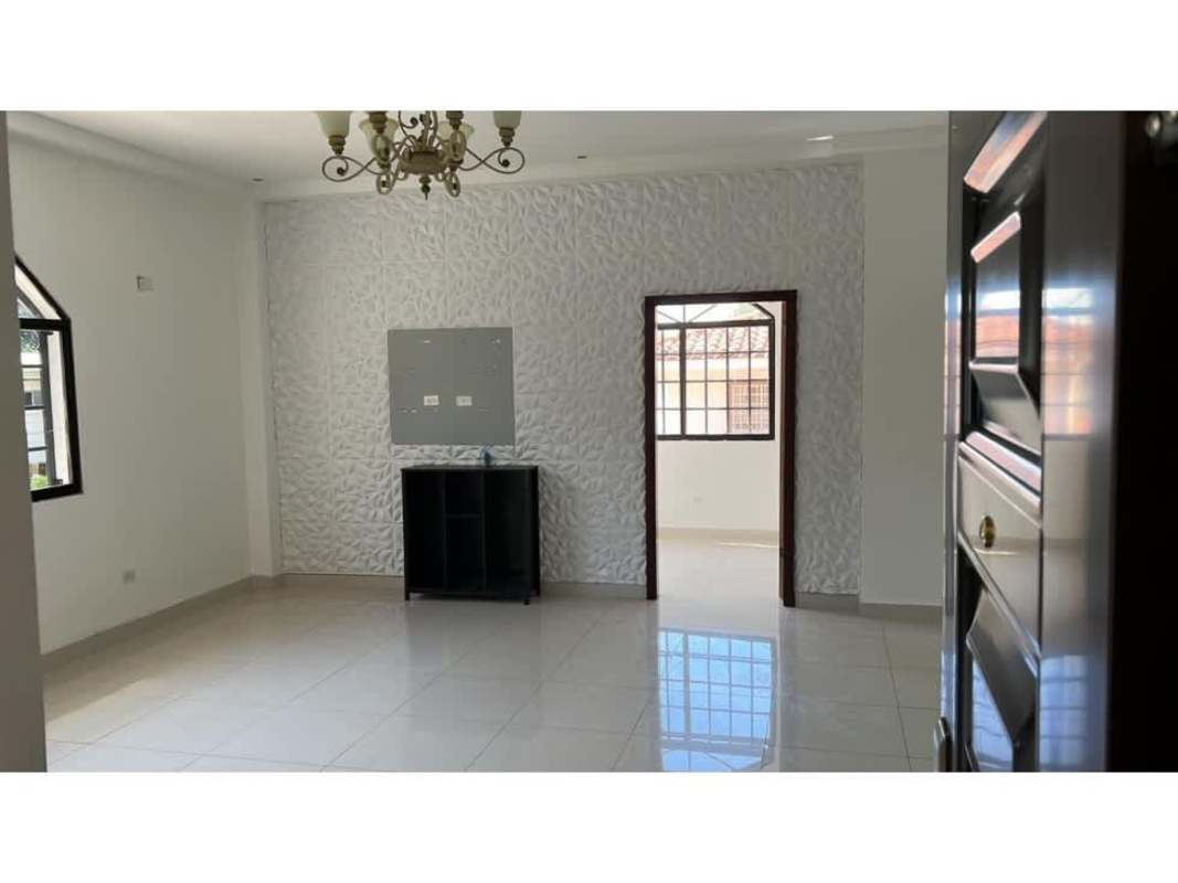 Spacious bedroom with arched window and tiled floor in Llanos de Curundu house for sale