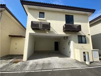 Facade of two-story house with garage and balconies in River Valley Panamá Pacífico community
