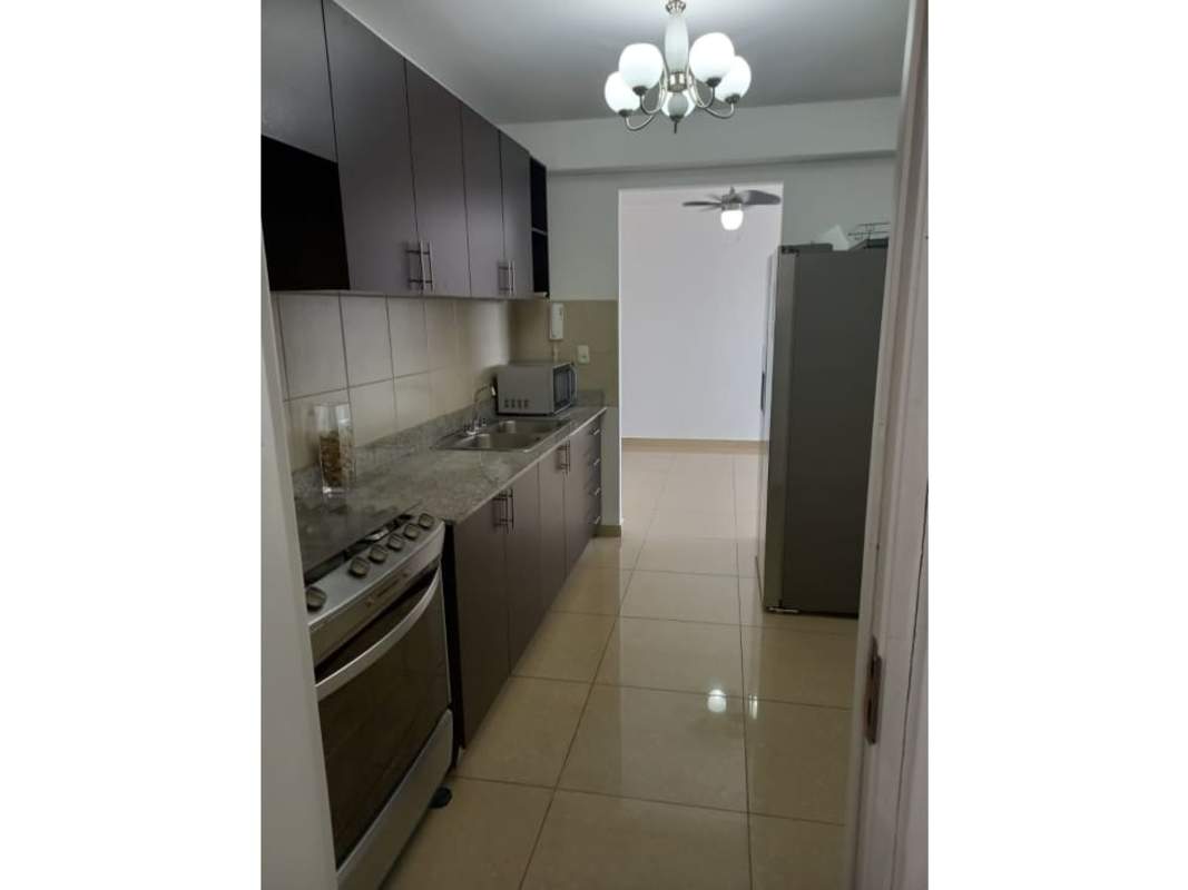 Galley kitchen granite counter backsplash modern appliances PH Urbis Tower Tumba Muerto Panama
