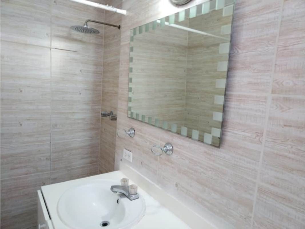 Bathroom with vanity cabinet, wall mirror, and modern fixtures in PH Montecarlo El Dorado