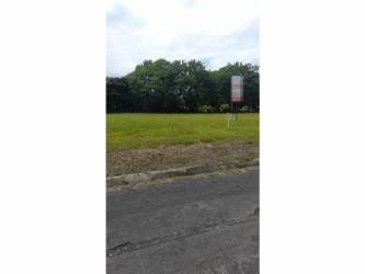 Entrance gate and paved internal streets of Palmeras del Golf residential Coronado Panama