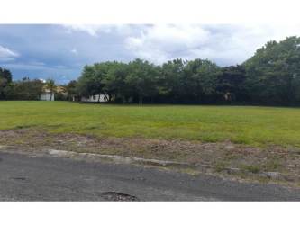 Vacant lot with paved road and utility access in Palmeras del Golf Coronado Panama