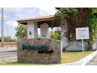 Mediterranean style gated entry of Palmeras del Golf with security booth in Coronado Panama