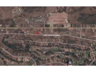 Stone engraved sign reading Palmeras del Golf at gated entrance Coronado Panama