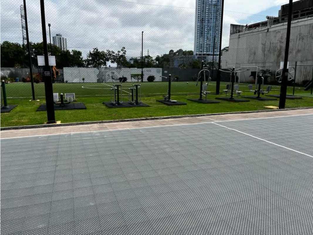 Bedroom with ceiling fan, closet, large window city view at PH Kings Park Condado del Rey Panama