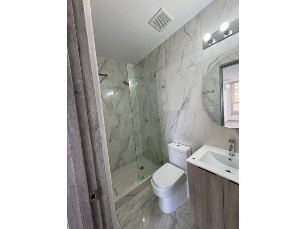 Modern living dining room ceramic floors balcony access PH The Gray Panama rental