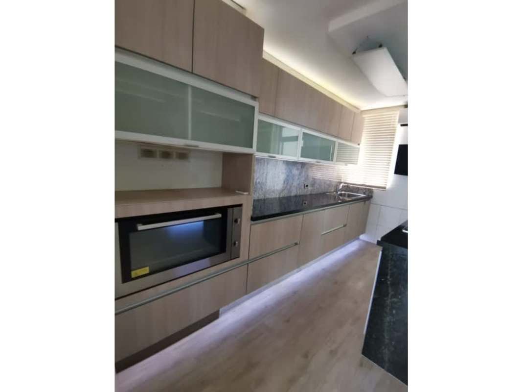 Spacious living and dining area opening onto sea-view balcony high floor PH Courtyard View Punta Pacifica Panama