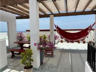 Bright balcony overlooking Pacific Ocean and gardens PH Playa del Sol San Carlos Panama