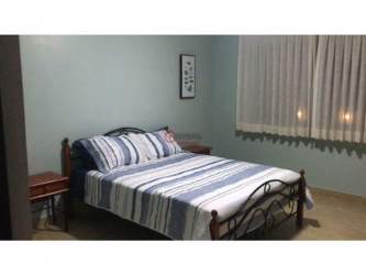 Bright living room with sliding doors to terrace Punta Barco Resort Panama beach villa