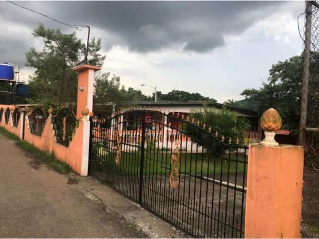 Bathroom with glass shower, blue wall tiles, sink and cabinets Villa Nueva Las Cumbres Panama