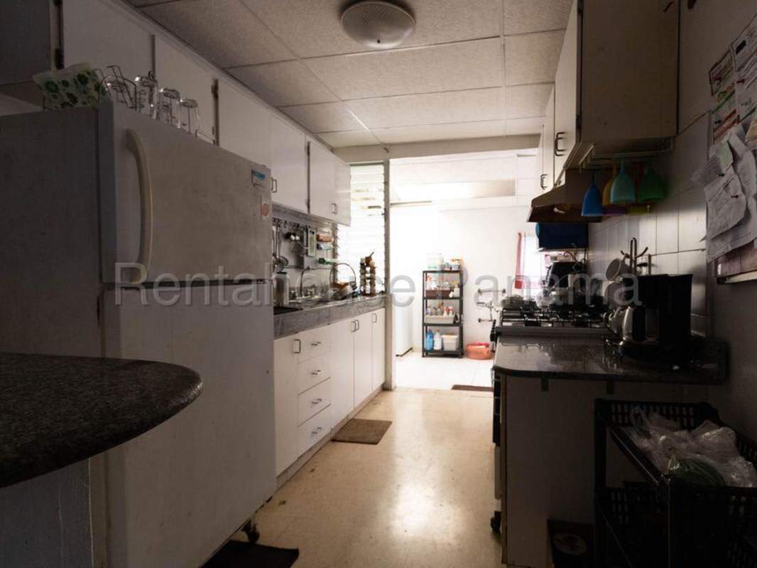 Living room with entertainment cabinet and tile floors Villa Lucre house for sale