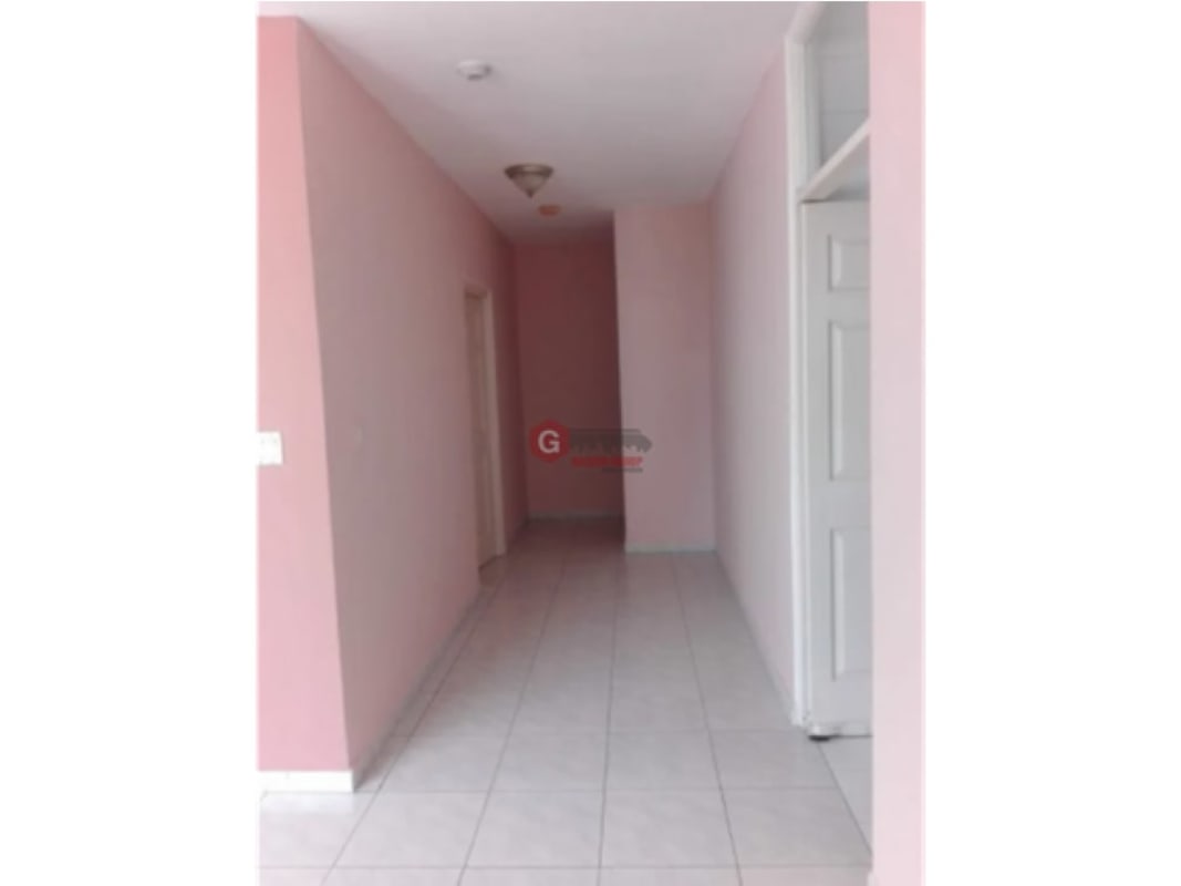 Hallway with ceramic floors pink walls inside apartment PH Royal Center Panama