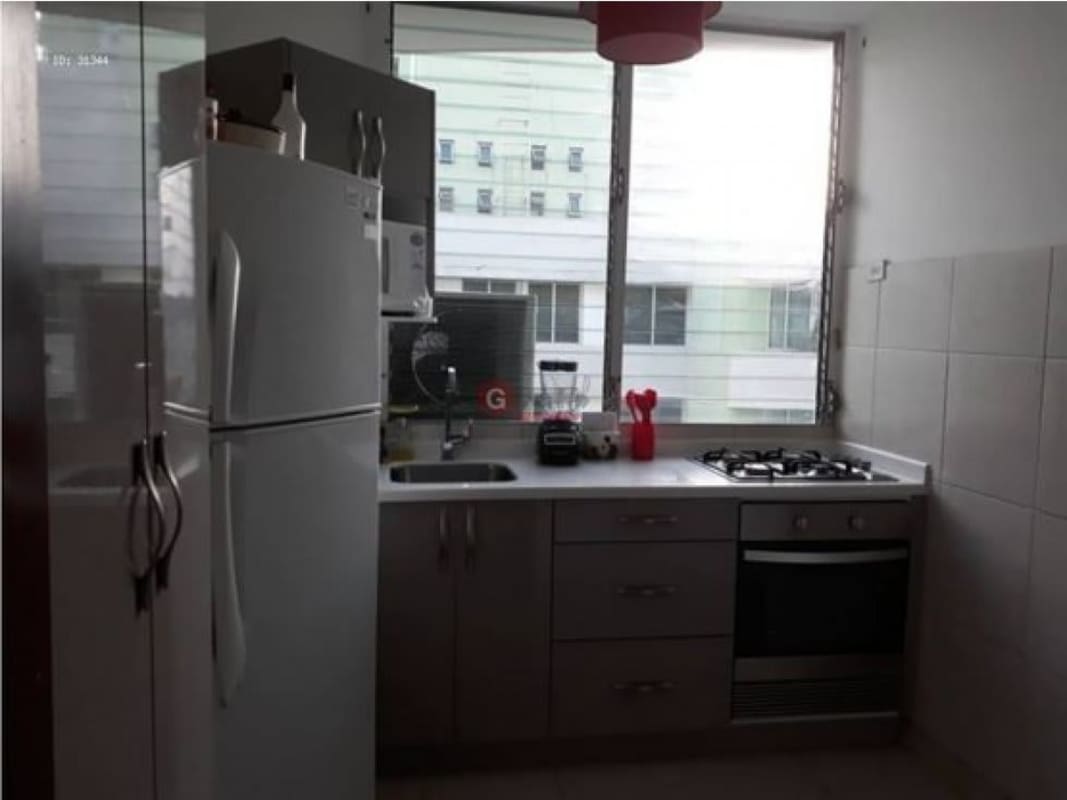 Gray cabinetry modern open kitchen PH Green Park Condado del Rey Panama apartment for sale