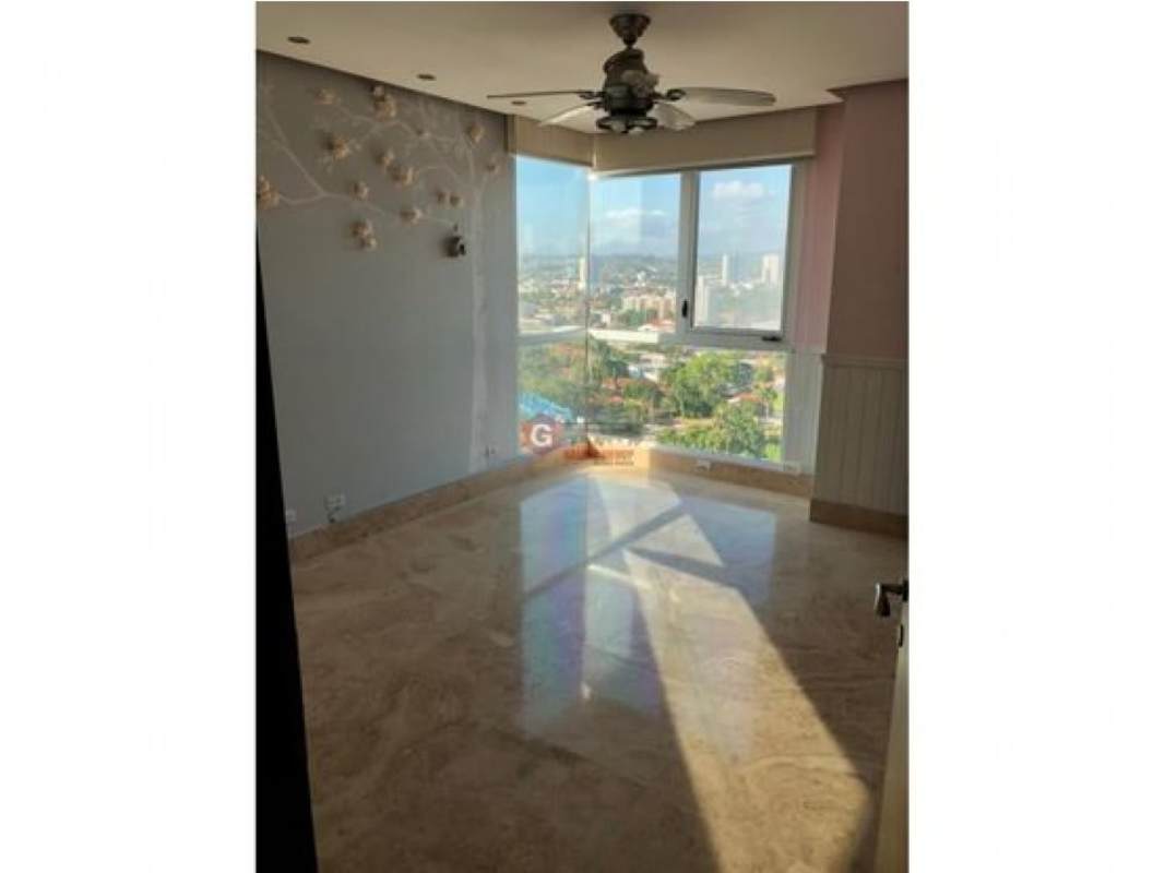 Spacious bedroom with marble flooring, ceiling fan, and stunning ocean view at PH Puntarenas Coco del Mar Panama