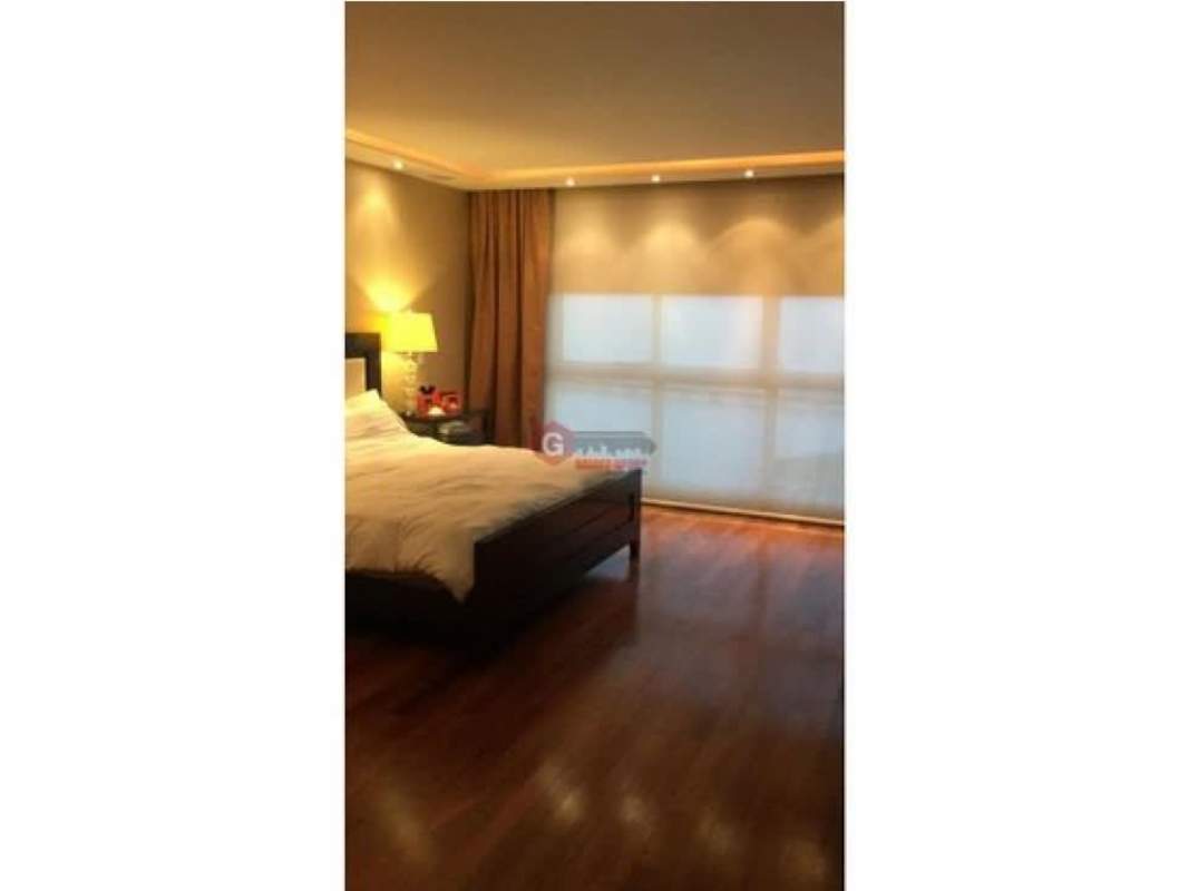 Spacious walk-in closet with wooden built-ins at PH Puntarenas Coco del Mar Panama