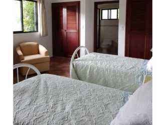 Modern kitchen in Valle Escondido home featuring granite countertops stainless-steel appliances ceramic backsplash