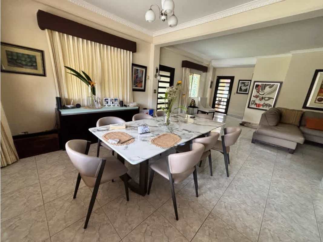 Elegant dining area with marble table and open-concept design in Albrook home Panama