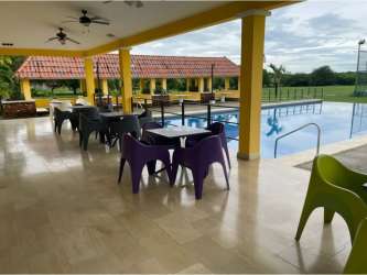 Social area with covered terrace and pool inside PH La Colonia de Chame Panama