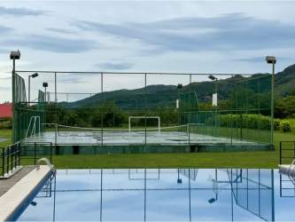 Outdoor recreational sports court and swimming pool at PH La Colonia de Chame Chame Panama