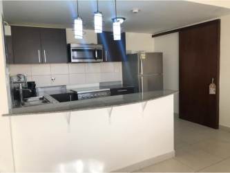 Aerial of red-roof houses green areas PH Midrise Woodlands Panama Pacifico