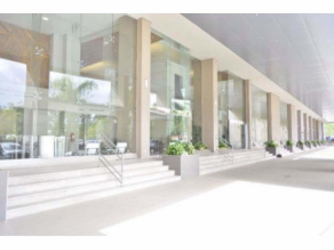 Glass facade commercial building with landscaped entrance in Costa del Este Panama