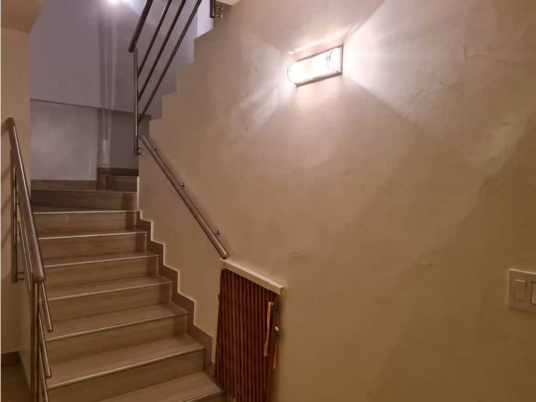 Bright penthouse bedroom featuring ocean view window, closet space, AC unit in Punta Pacifica Panama