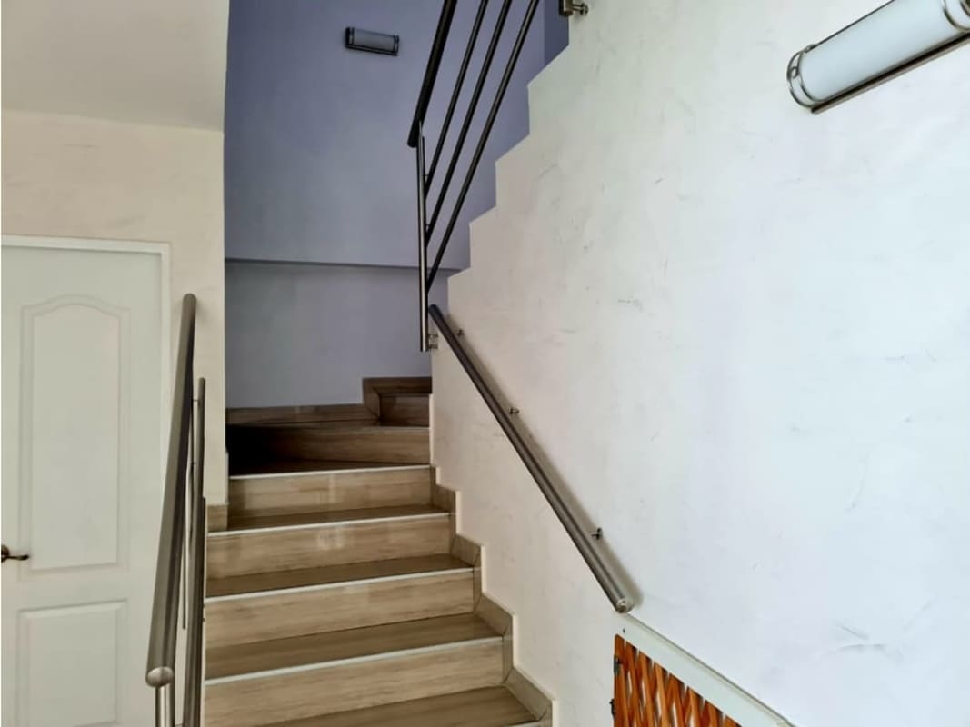 Bright duplex penthouse living-dining with balcony access, panoramic windows, city views at PH Pacific Sun Panama