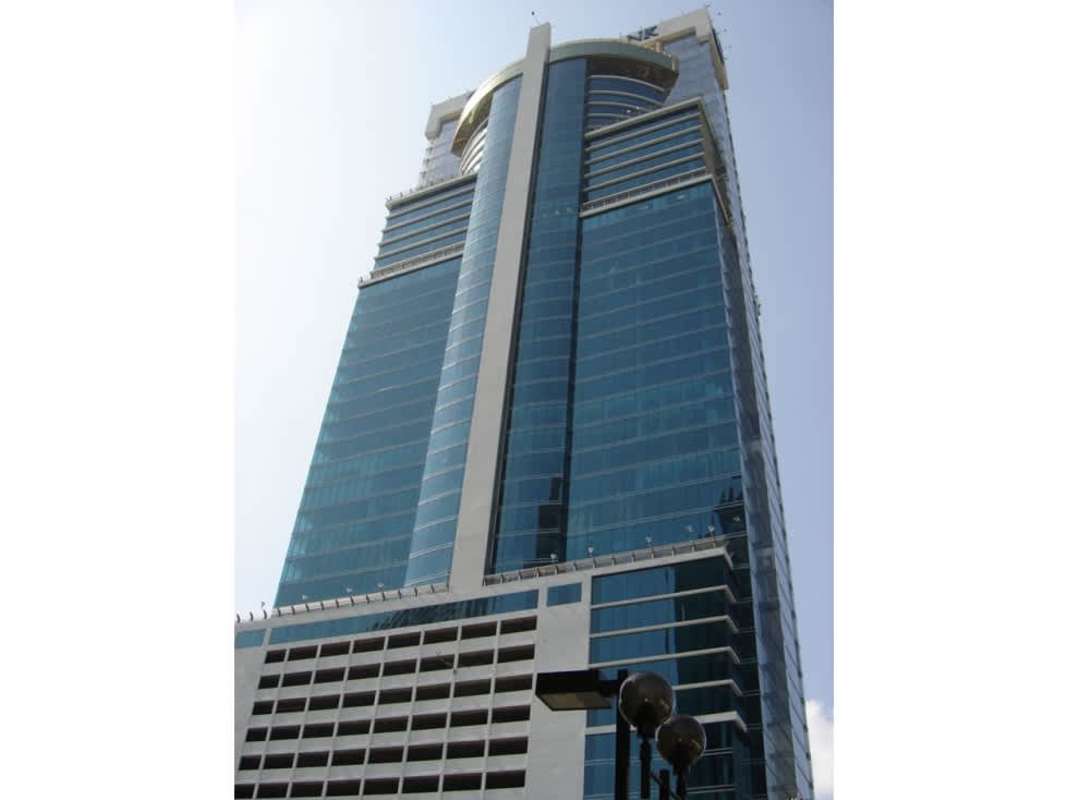 Tall blue glass skyscraper with curved top Global Bank Tower in Panama's financial district