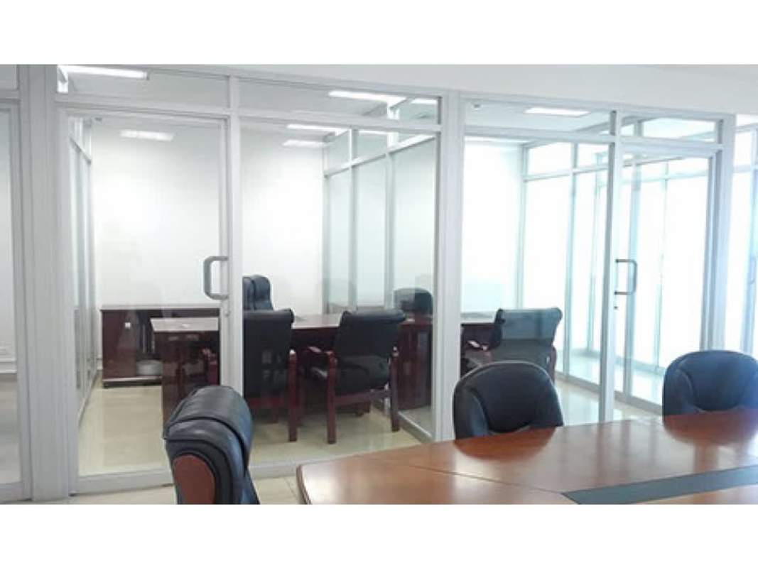 Glass-walled conference room with leather chairs in office space at Global Bank Tower Panama City