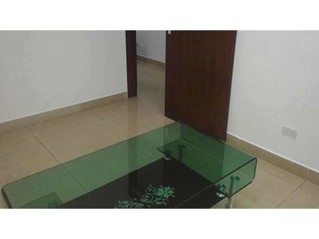 Minimalist waiting area with beige tiles and glass table inside office space for rent at Global Bank Tower Panama