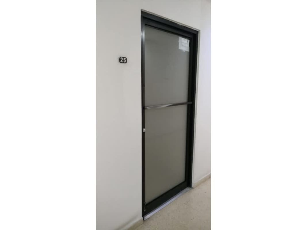 Office hallway with windows and multiple rooms at PH BICSA Avenue Balboa Panama