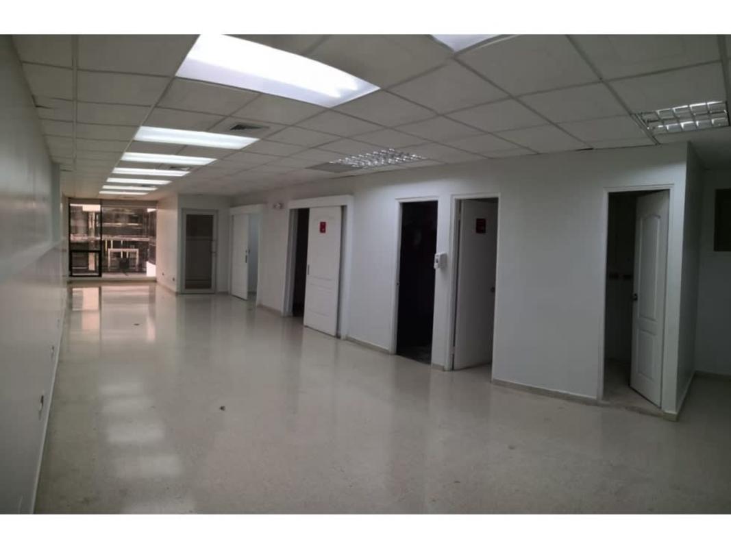 Hallway of commercial units inside BICSA Tower with modern glass doors in Panama City