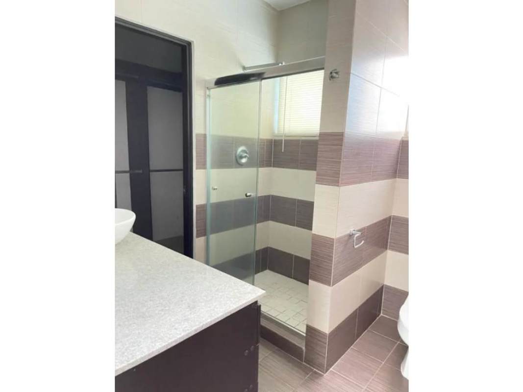 Bathroom with vessel sink, striped tile and glass shower in The View Coco del Mar Panama