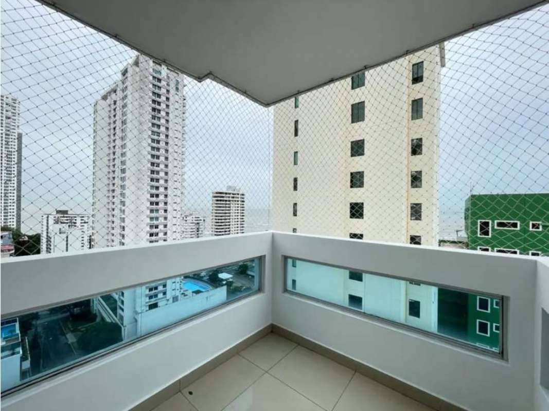 Balcony with safety net, overlooking surrounding high-rise city and Pacific Ocean view Panama