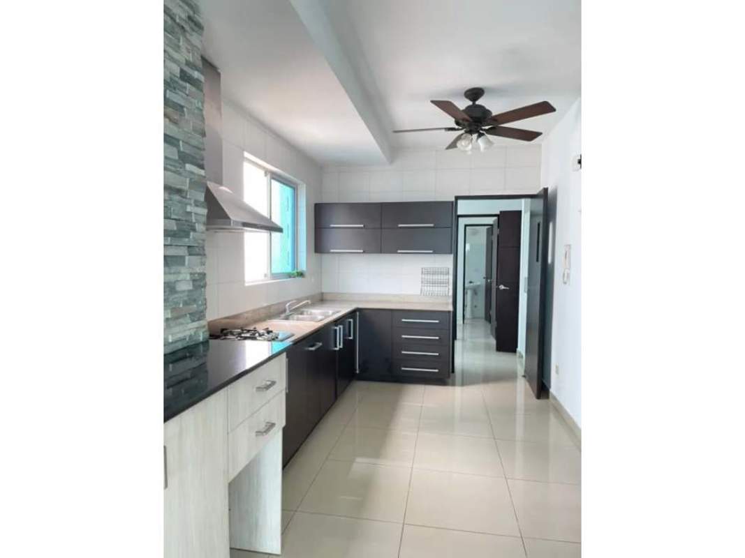 Modern kitchen with large window, premium cabinets and ocean views at The View Panama