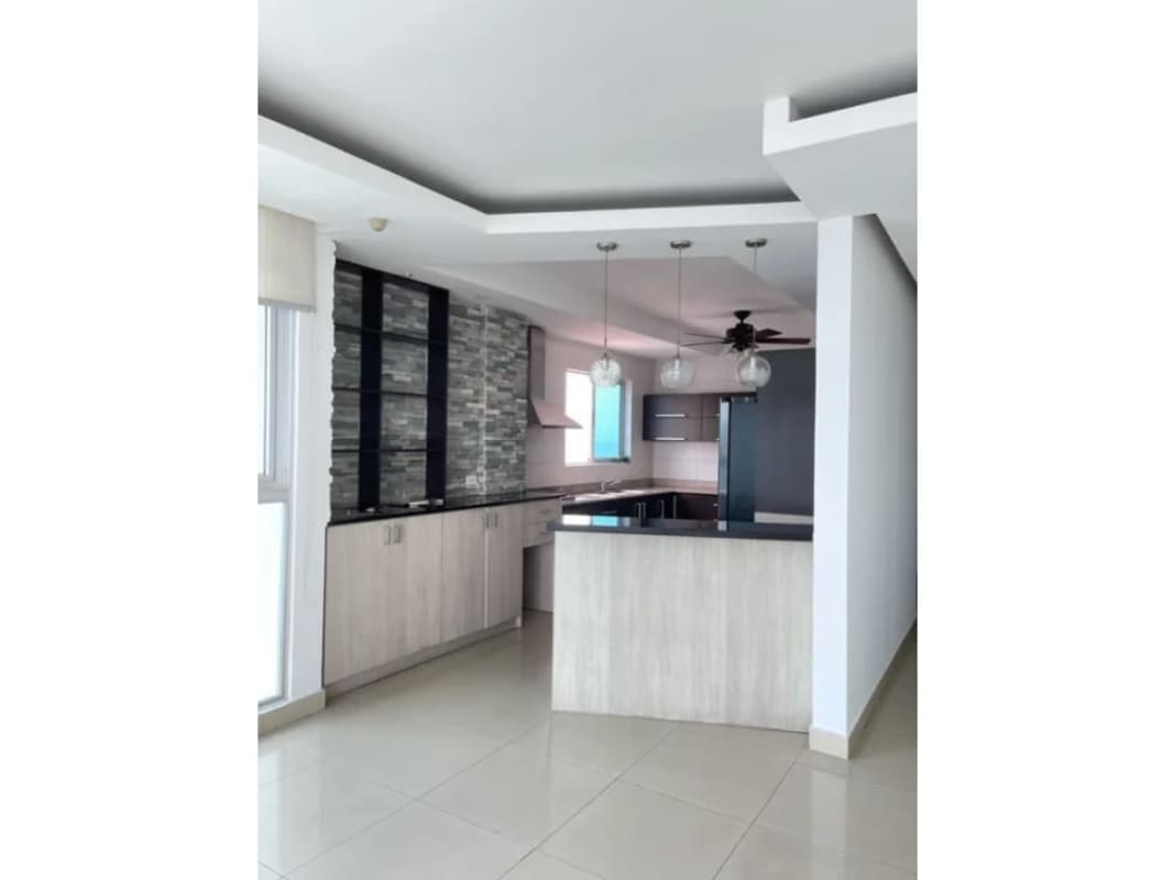 Kitchen with granite countertops, pendant lighting in The View Coco del Mar Panama