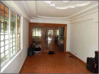 Spacious living area with large windows, ceramic tile flooring Howard house Panama