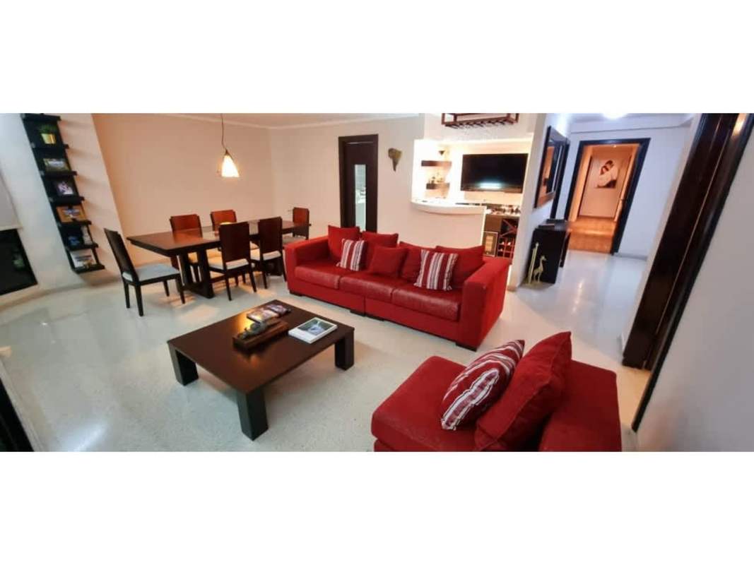 Kitchen with granite countertops, white cabinetry and window in Punta Paitilla