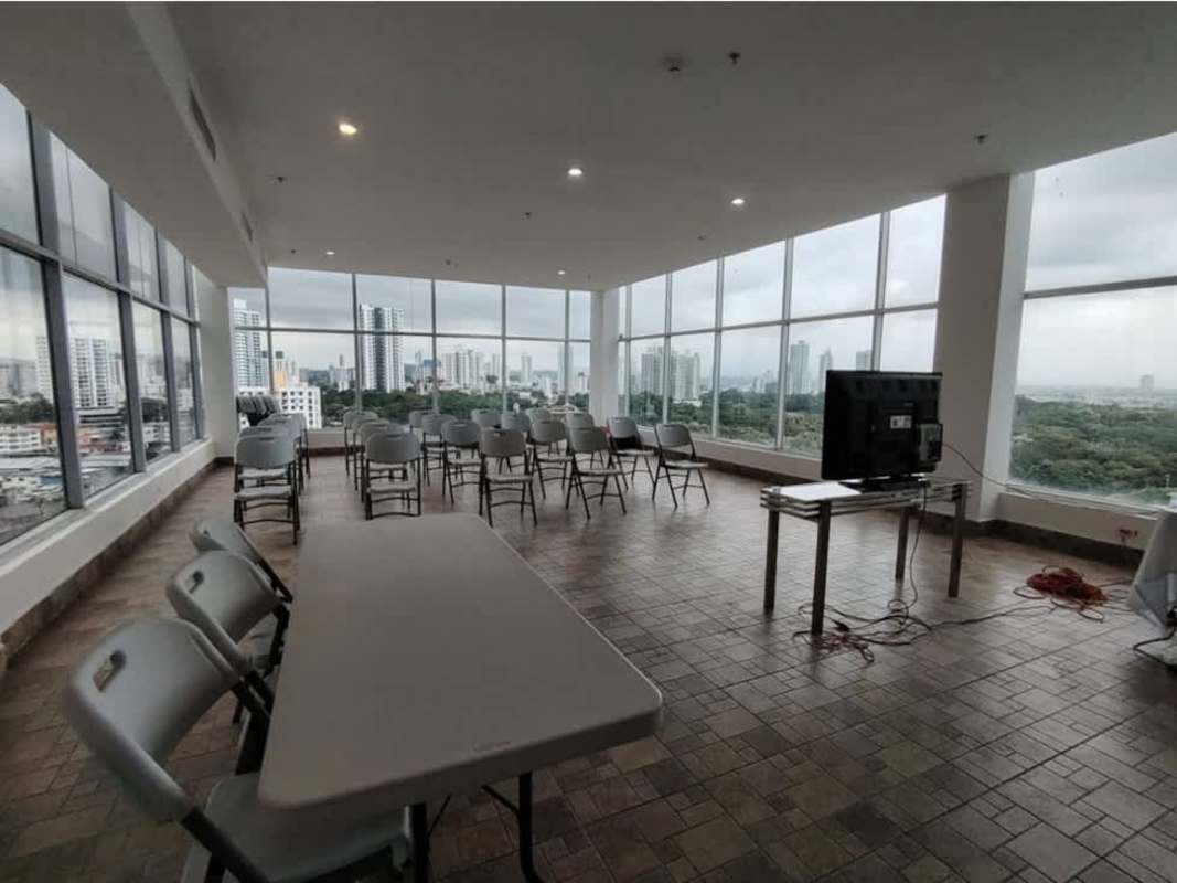 Living room with natural light, ceramic floors, and Panama City skyline in Window Tower