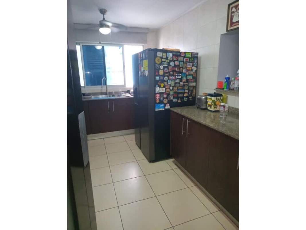 Modern dining room stone accent wall wood table PH Constellation Tower Dos Mares Panama