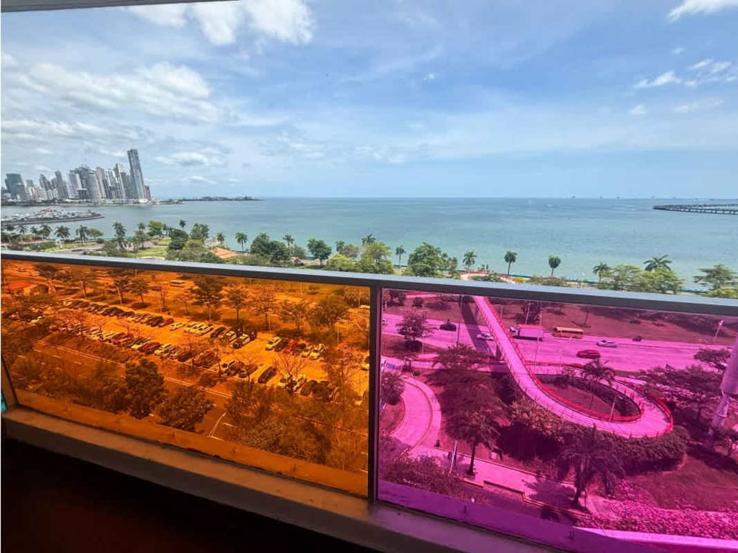 Open kitchen with granite countertop, appliances, ocean view in PH Element Avenida Balboa Panama