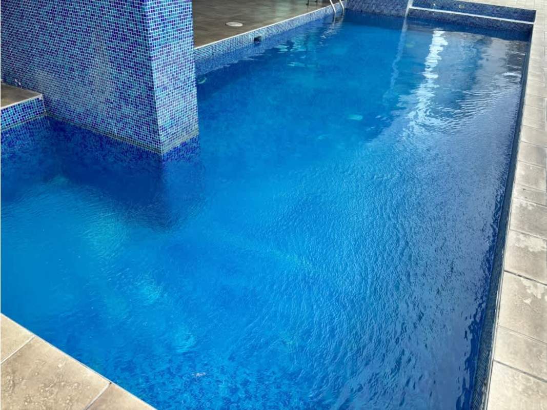 Bright living room with large floor-to-ceiling windows and ocean view in duplex penthouse PH Pacific Sea Punta Paitilla