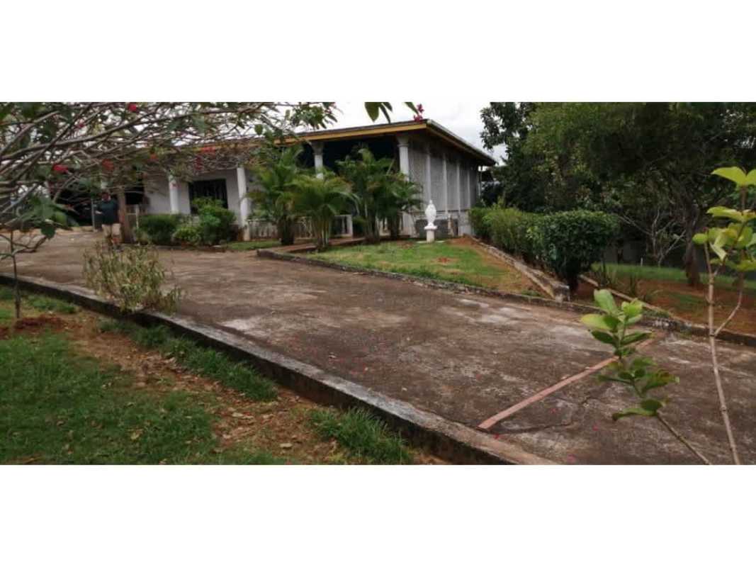 Living room with colorful walls, arches and ceramic floor in La Higuera country house Panama