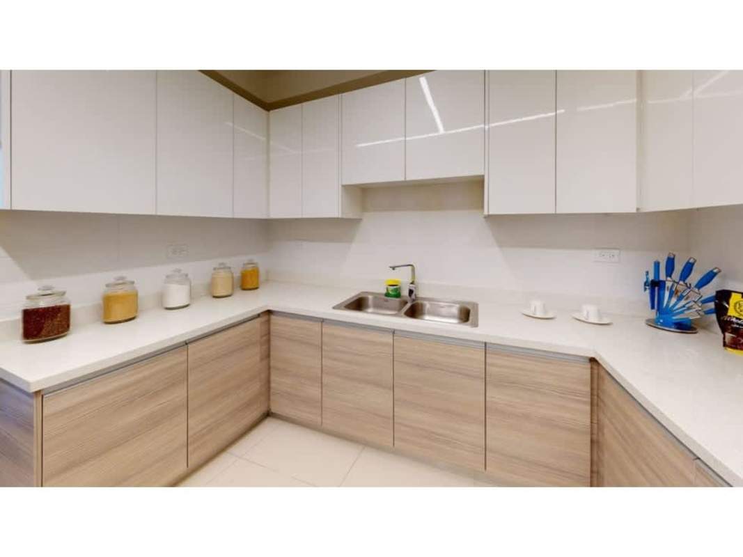 Galley kitchen with granite counters stainless appliances PH Balboa Bay Avenida Balboa Panama